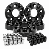 A set of black anodized wheel spacers with matching lug nuts, including silver chrome lug nuts and black lug nuts, arranged on a clean white background.